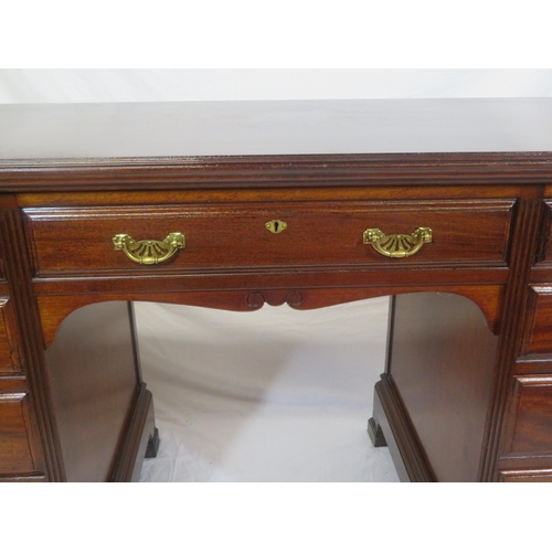 310 - Edwardian mahogany kneehole desk with 9 drawers, brass drop handles with pierced backplates, on brac... 