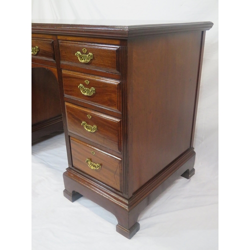 310 - Edwardian mahogany kneehole desk with 9 drawers, brass drop handles with pierced backplates, on brac... 