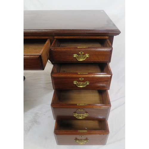 310 - Edwardian mahogany kneehole desk with 9 drawers, brass drop handles with pierced backplates, on brac... 