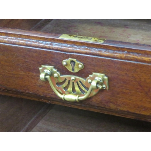 310 - Edwardian mahogany kneehole desk with 9 drawers, brass drop handles with pierced backplates, on brac... 