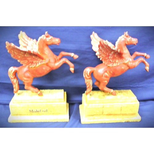 312 - Pair of cast iron 'Mobil Oil' Pegasus horse advertising figures on oblong bases