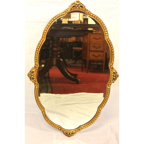 319 - Regency design oval bevelled glass shaped wall mirror