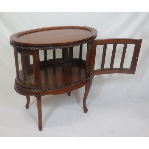 335 - Edwardian design oval butlers cabinet with serving tray, bevelled glass insets, on sabre legs