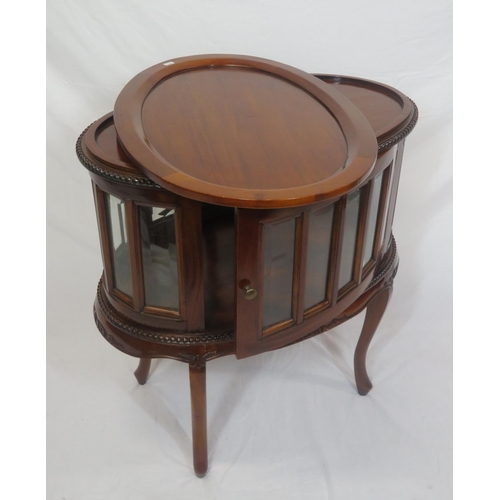 335 - Edwardian design oval butlers cabinet with serving tray, bevelled glass insets, on sabre legs