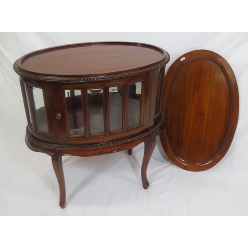 335 - Edwardian design oval butlers cabinet with serving tray, bevelled glass insets, on sabre legs