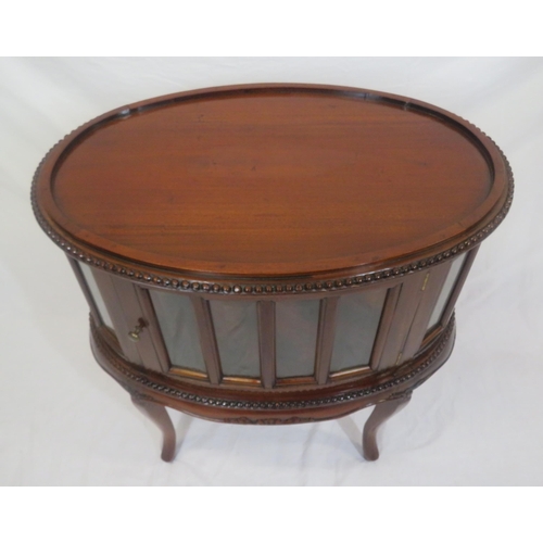 335 - Edwardian design oval butlers cabinet with serving tray, bevelled glass insets, on sabre legs