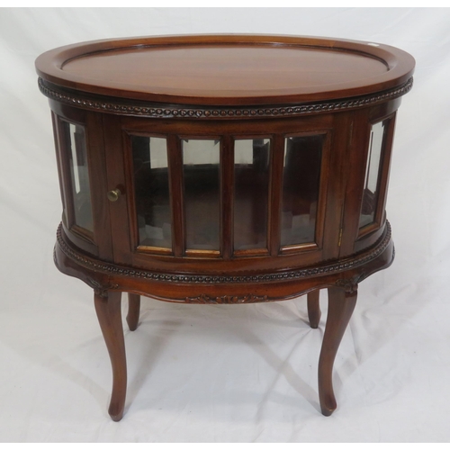 335 - Edwardian design oval butlers cabinet with serving tray, bevelled glass insets, on sabre legs