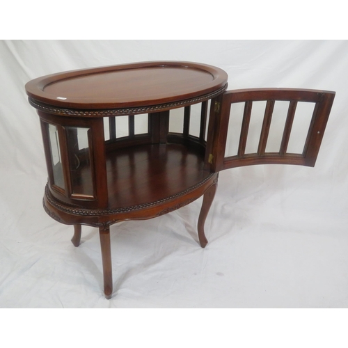 335 - Edwardian design oval butlers cabinet with serving tray, bevelled glass insets, on sabre legs