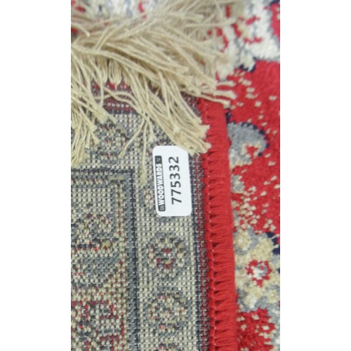 352 - Red ground full pile Kashmir rug with all over floral pattern