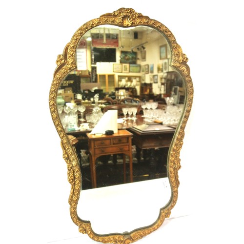 353 - Regency design gilt framed shaped wall mirror with shell and foliate decoration