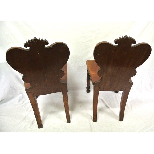 372 - Pair of Victorian mahogany hall chairs with shaped backs, inset crests, bowfront seats, on turned ta... 