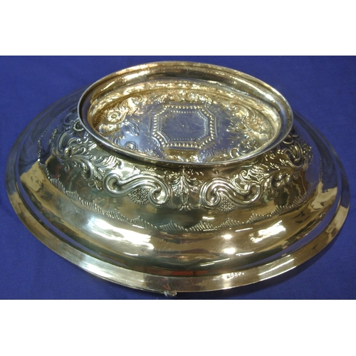 100 - London George III silver oval basket with reeded swing handle and rim, ornate foliate and scroll dec... 