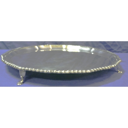 101 - George V Chester silver round serving tray with wavy gadroon raised rim, on 4 cast pad feet, 650g, 3... 