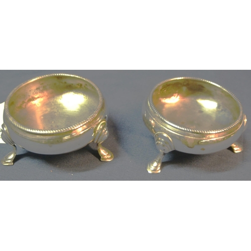 104 - Pair of Georgian London silver round salts with gadroon rims and on 3 cast pad feet