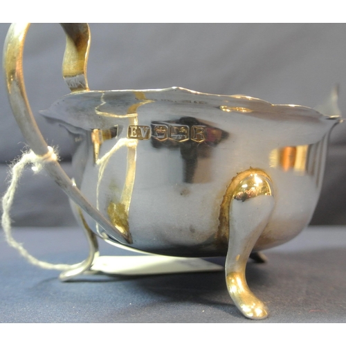 107 - Sheffield silver boat shaped sauce or gravy boat with wavy rim, scroll handle, on 3 pad feet