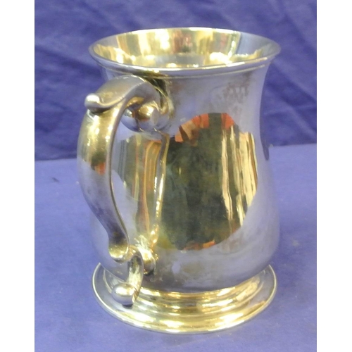 113 - George III London silver mug of baluster form, crested,  with initialled scroll handle and round spr... 