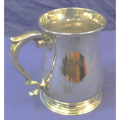 113 - George III London silver mug of baluster form, crested,  with initialled scroll handle and round spr... 