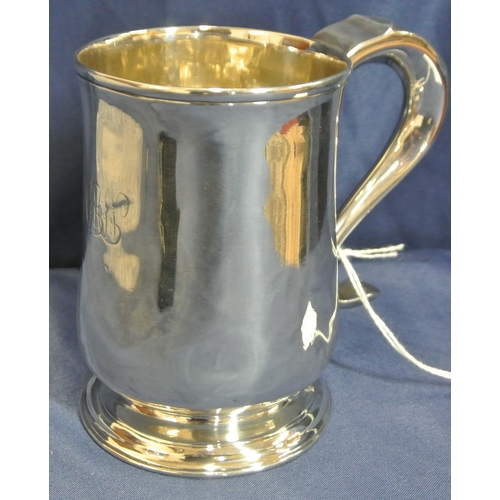 113 - George III London silver mug of baluster form, crested,  with initialled scroll handle and round spr... 