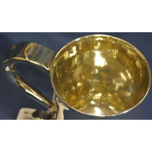 113 - George III London silver mug of baluster form, crested,  with initialled scroll handle and round spr... 