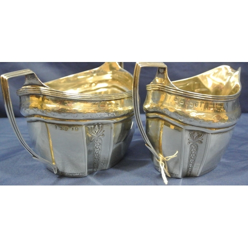 118 - George III London silver cream jug and sugar bowl of oval panelled form, with reeded rims and handle... 