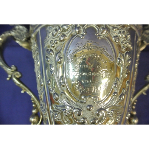 125 - Sheffield Victorian silver trophy cup of round tapering form decorated with winged lions, faces, scr... 