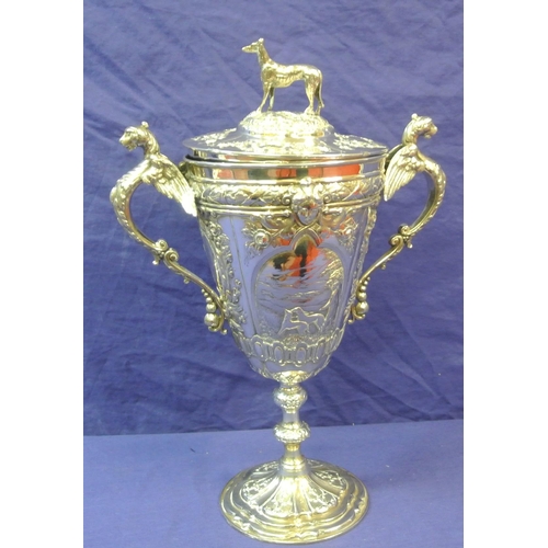 125 - Sheffield Victorian silver trophy cup of round tapering form decorated with winged lions, faces, scr... 