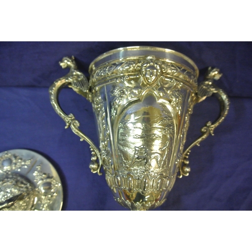 125 - Sheffield Victorian silver trophy cup of round tapering form decorated with winged lions, faces, scr... 