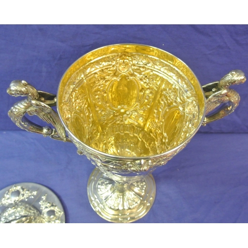 125 - Sheffield Victorian silver trophy cup of round tapering form decorated with winged lions, faces, scr... 