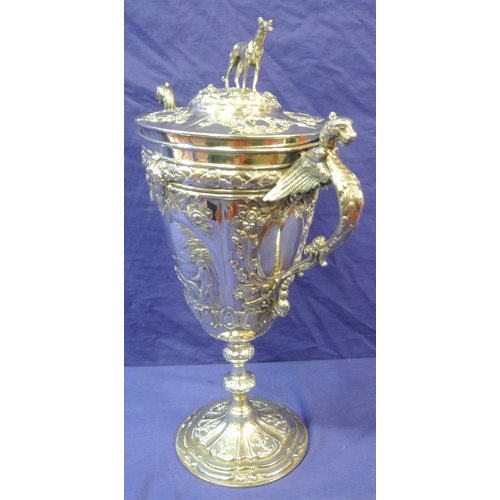 125 - Sheffield Victorian silver trophy cup of round tapering form decorated with winged lions, faces, scr... 