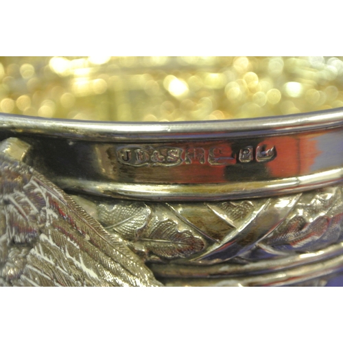 125 - Sheffield Victorian silver trophy cup of round tapering form decorated with winged lions, faces, scr... 