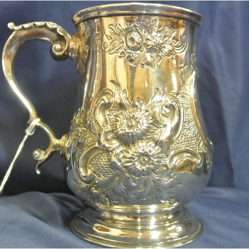 136 - London Victorian silver baluster shaped mug with ornate foliate embossing, scroll cartouche, leaf ca... 