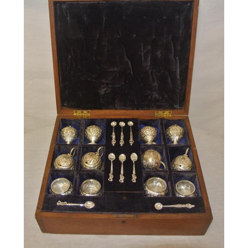 22 - 12 piece Indian silver condiment set with ornate scroll and foliate embossing, in fitted presentatio... 