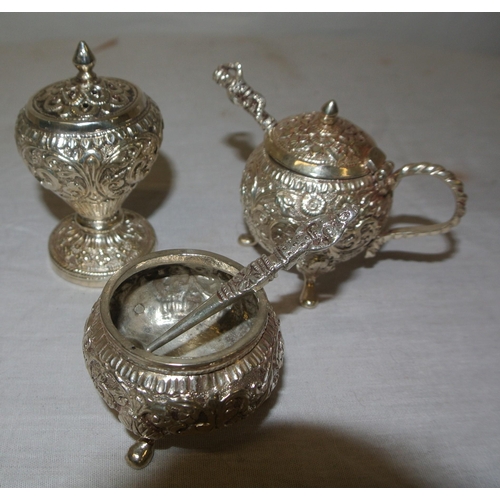 22 - 12 piece Indian silver condiment set with ornate scroll and foliate embossing, in fitted presentatio... 