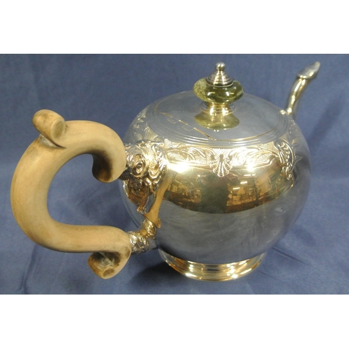 221 - Irish silver teapot of ball form with foliate chased band, shaped spout and timber handle, on round ... 