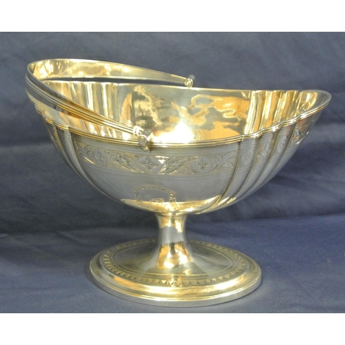 222 - Irish George III silver sugar basket with reeded swing handle, reeded rim, ribbed and foliate decora... 