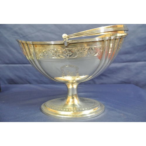 222 - Irish George III silver sugar basket with reeded swing handle, reeded rim, ribbed and foliate decora... 