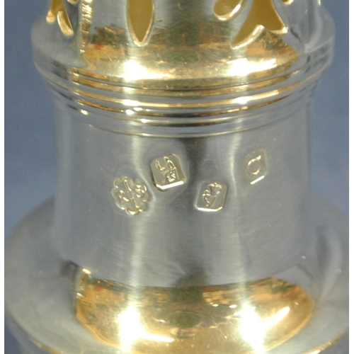 231 - Irish silver sugar caster with domed pierced top, finial, vase shaped lower body, on round stepped b... 