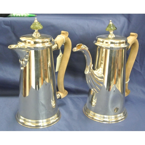 236 - Irish Silver teapot and hot water pot of round tapering form, lids with marble finials, shaped spout... 