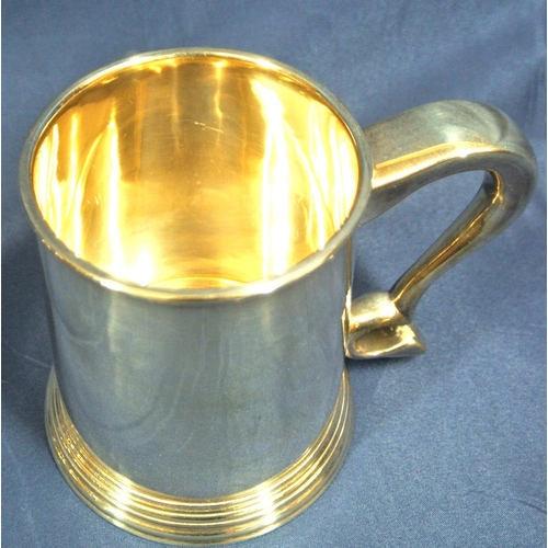 240 - Pair of Irish Silver tankards of round tapering form with reeded rims, shaped handles, on stepped ba... 