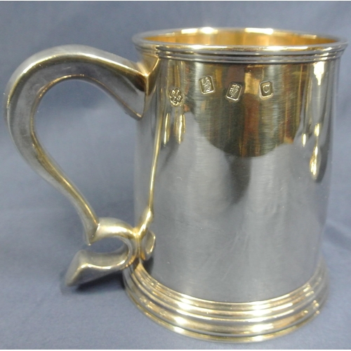 240 - Pair of Irish Silver tankards of round tapering form with reeded rims, shaped handles, on stepped ba... 