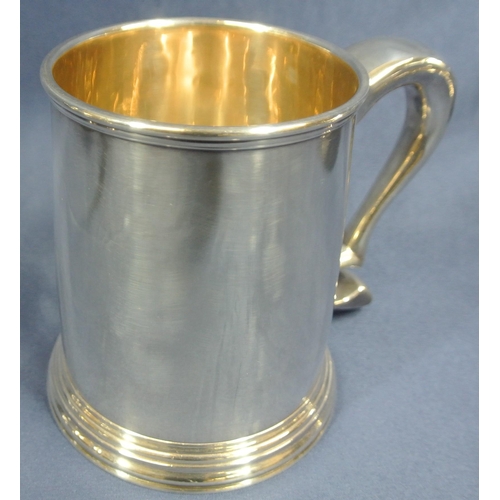 240 - Pair of Irish Silver tankards of round tapering form with reeded rims, shaped handles, on stepped ba... 