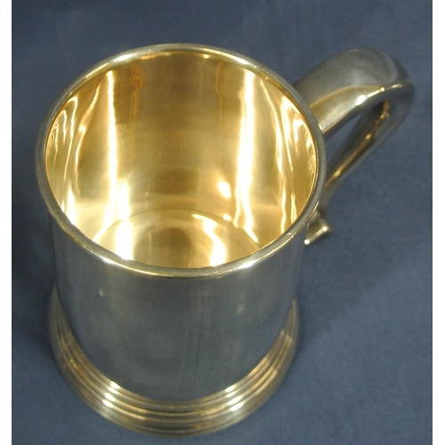 240 - Pair of Irish Silver tankards of round tapering form with reeded rims, shaped handles, on stepped ba... 