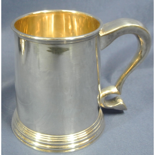 240 - Pair of Irish Silver tankards of round tapering form with reeded rims, shaped handles, on stepped ba... 