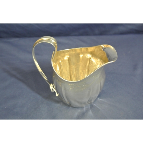 241 - Cork Silver George III cream jug with bright-cut foliate engraving and shaped handle, by John Nichol... 