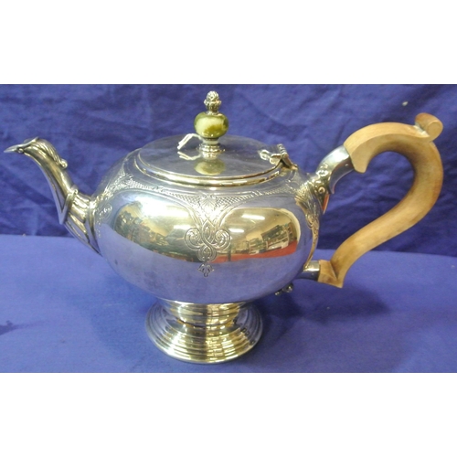 244 - Irish silver teapot of ball form, lid with marble finial, shaped spout and timber handle, foliate ch... 