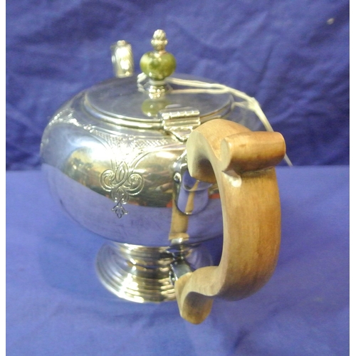 244 - Irish silver teapot of ball form, lid with marble finial, shaped spout and timber handle, foliate ch... 