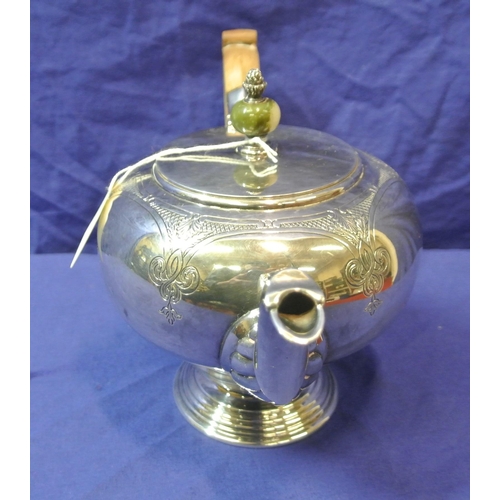 244 - Irish silver teapot of ball form, lid with marble finial, shaped spout and timber handle, foliate ch... 