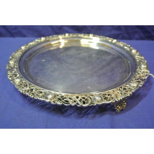 245 - Large Irish Silver round tray or server with ornate pierced and Celtic decorated raised border, on 3... 