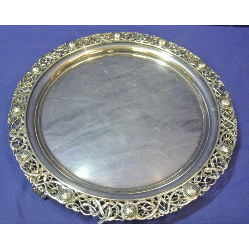 245 - Large Irish Silver round tray or server with ornate pierced and Celtic decorated raised border, on 3... 