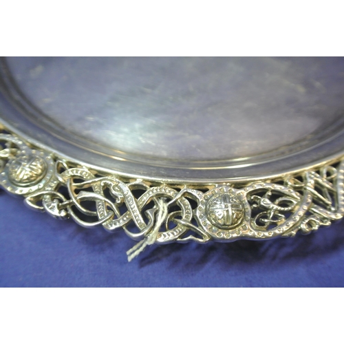 245 - Large Irish Silver round tray or server with ornate pierced and Celtic decorated raised border, on 3... 